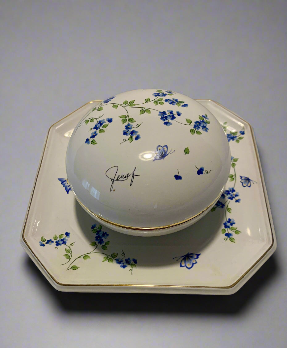 Vintage porcelain bowl with hand-painted blue floral pattern and gold trim, dome-shaped with matching square base and wall mount, 1980s collectible.