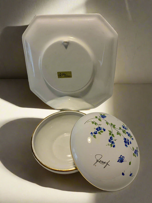 Vintage porcelain bowl with hand-painted blue floral pattern and gold trim, dome-shaped with matching square base and wall mount, 1980s collectible.