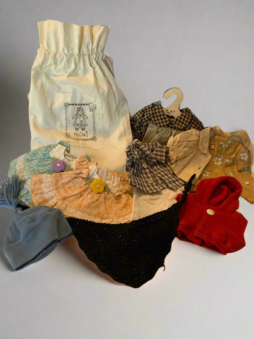 Vintage 1990s My Doll cloth doll with red yarn hair, original dress, cotton storage bag, and complete handmade clothing wardrobe – made in Italy.