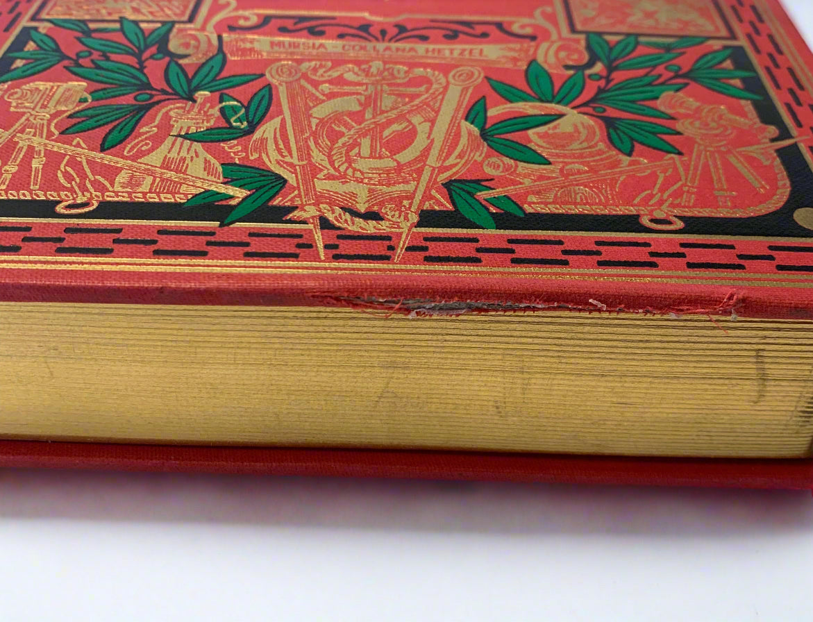 Vintage 1980s Italian edition of Jules Verne’s “L’Isola Misteriosa” with ornate red and gold embossed hardcover – I Viaggi Straordinari series by Mursia.