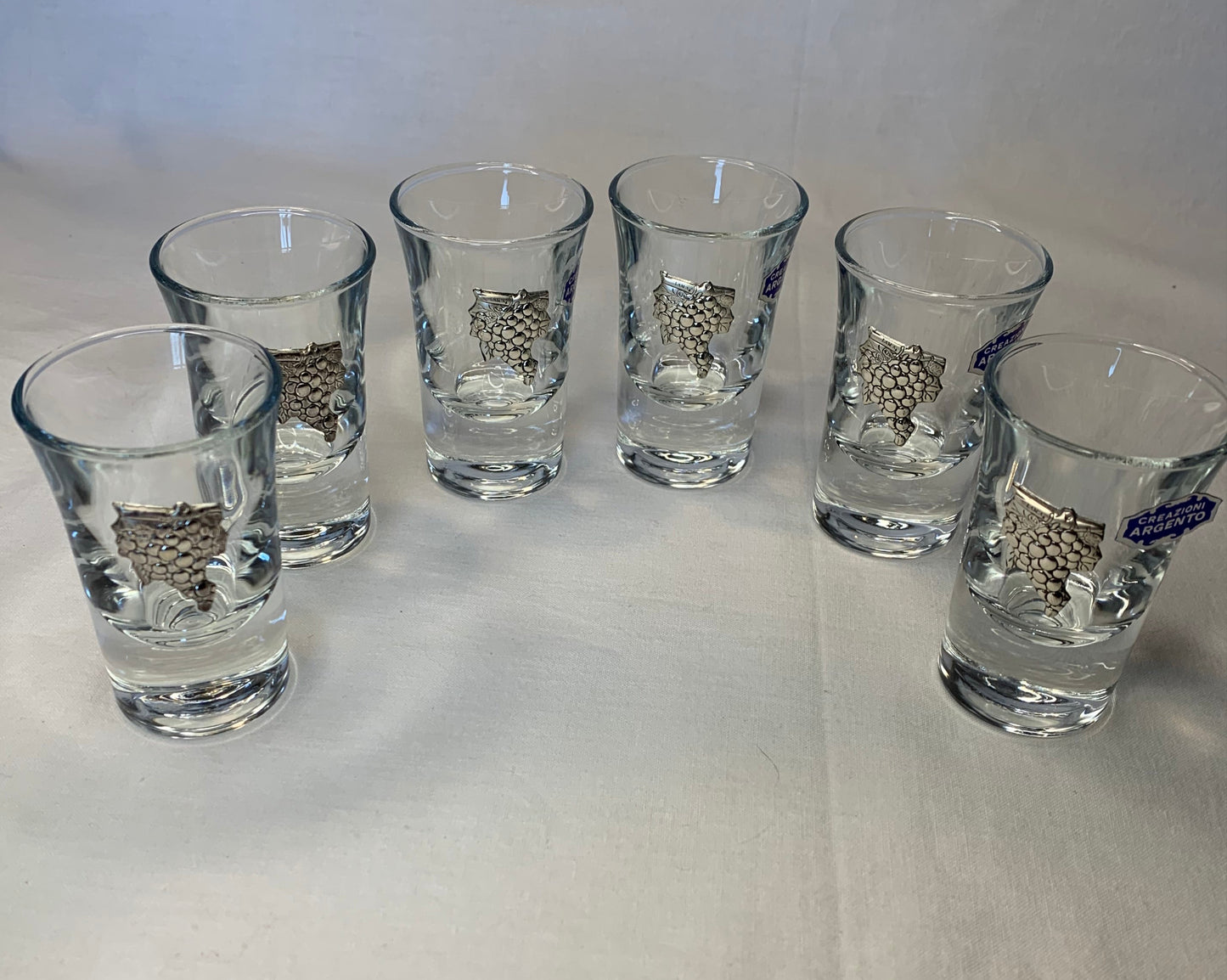 Set of 6 vintage shot glasses with raised silver grapevine motif – 7cm tall, clear glass, unused and in perfect condition.