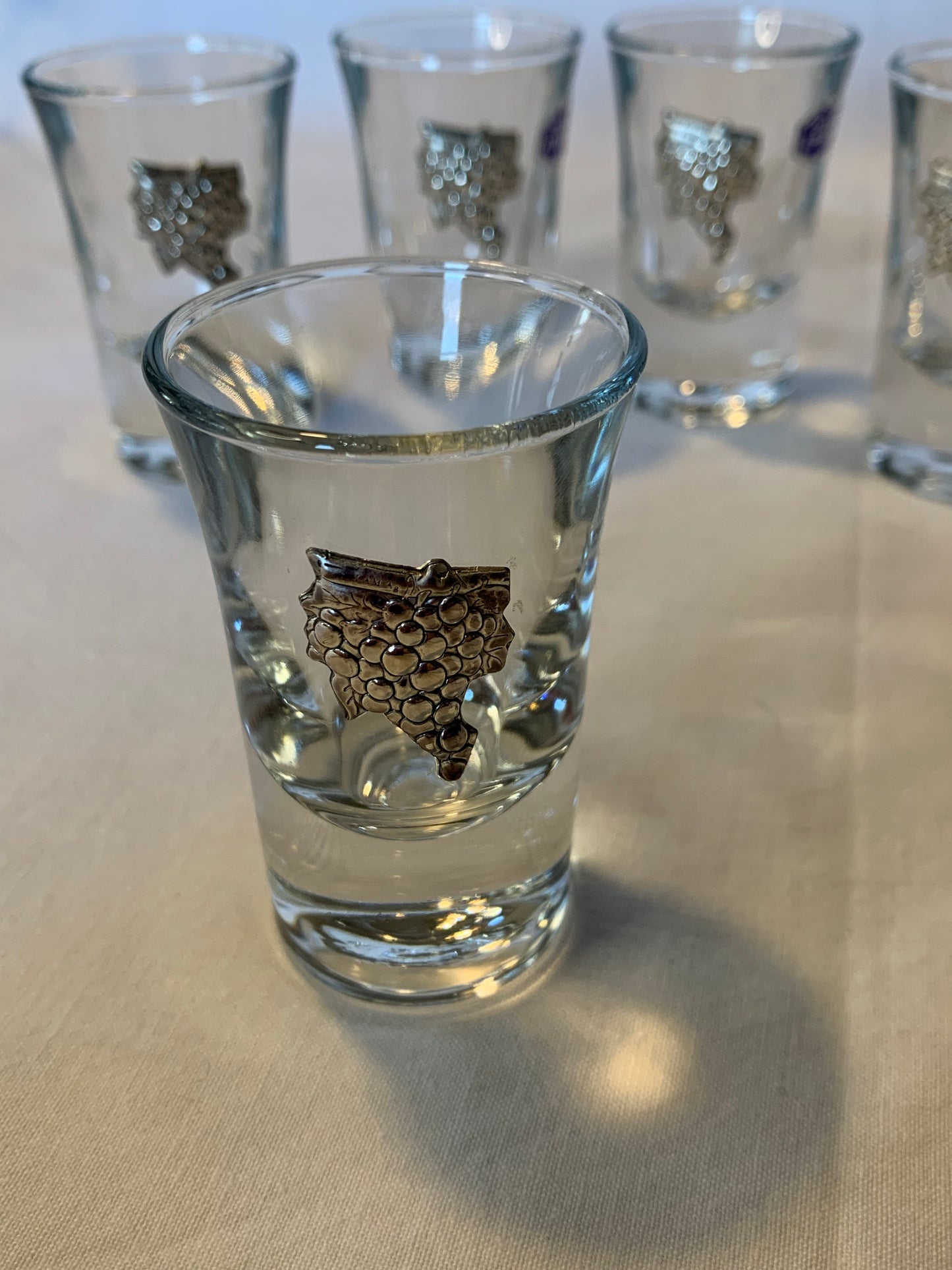 Set of 6 vintage shot glasses with raised silver grapevine motif – 7cm tall, clear glass, unused and in perfect condition.